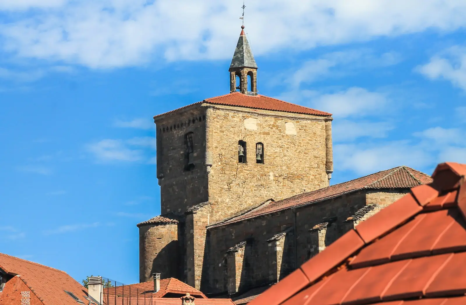 brown brick building under blue sky during daytime